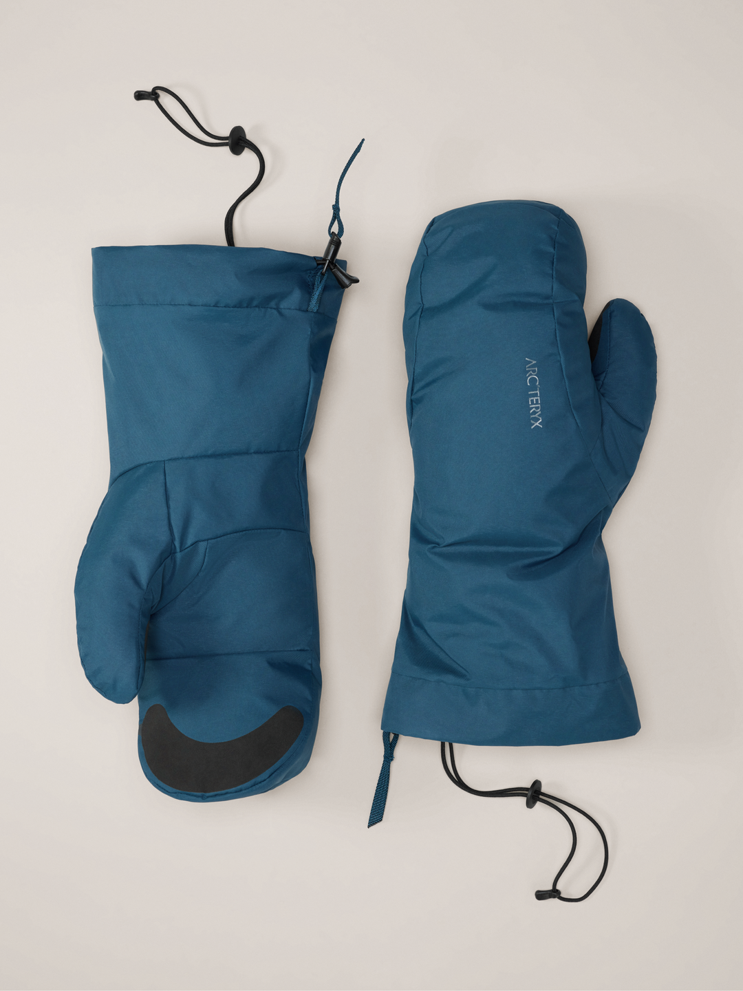 Nightscape blue Arc'teryx Beta down mittens on gray background