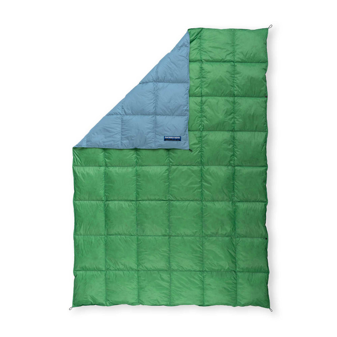 Feathered Friends Shamrock green and light blue ultralight down blanket on white background
