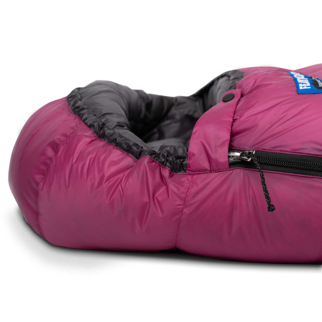 Side view of the hood and side zipper of Feathered Friends Egret UL women's ultralight down sleeping bag in Magenta purple on white background