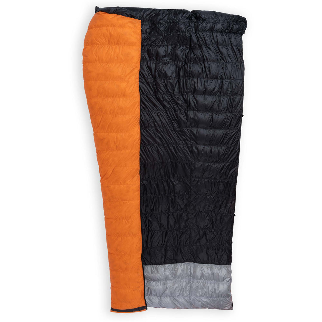 Half unzipped Feathered Friends Flicker UL Ultralight Down Quilt Sleeping Bag in Flame Orange showing the interior on a white background