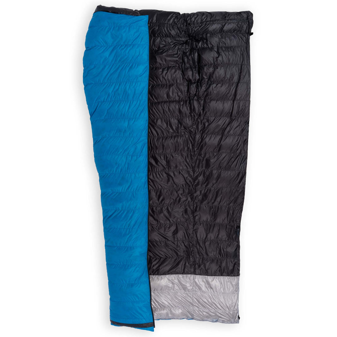 Feathered Friends Flicker UL Wide Ultralight Down Quilt Sleeping Bag in Cerulean Blue half unzipped to display the interior