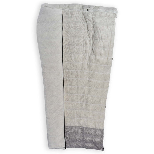 Feathered Friends Flicker UL Wide Ultralight Down Quilt Sleeping Bag half unzipped showing the undyed shell and interior fabrics with Pertex Diamond Fuse in the footbox