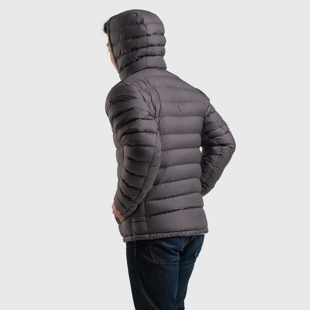 Back view studio photo of a man wearing Steel Gray color Feathered Friends Eos Jacket