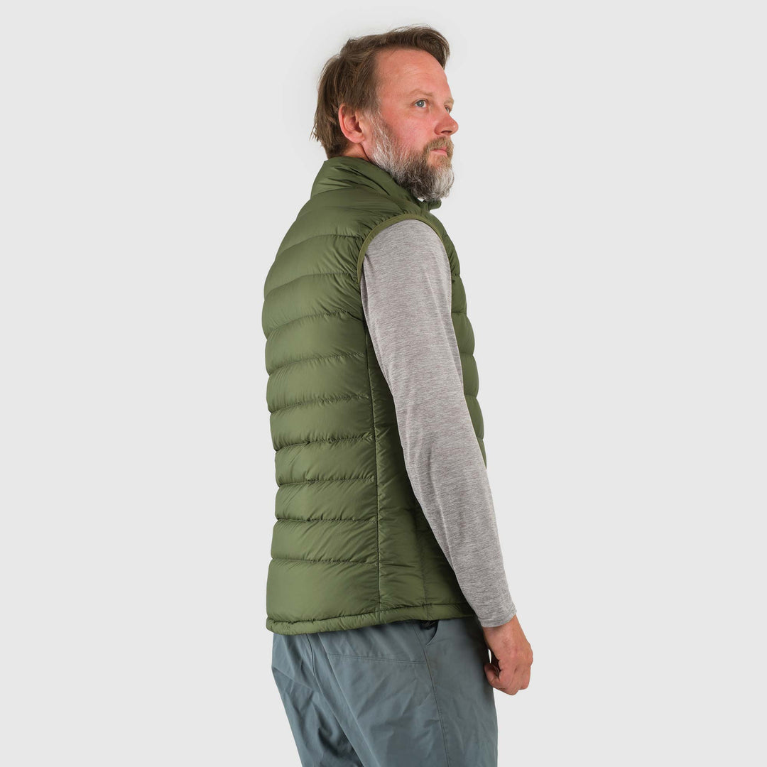 Studio side view of a man wearing a chive green  Men's Feathered Friends Eos Vest