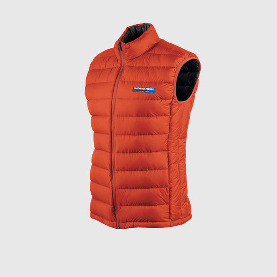 Studio front view of Men's Feathered Friends Eos Vest Rorange red color