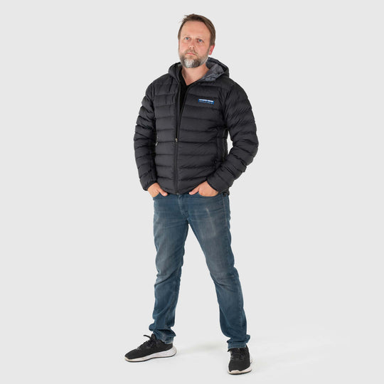 Studio front view of man wearing a black Men's Feathered Friends Eos Down Jacket
