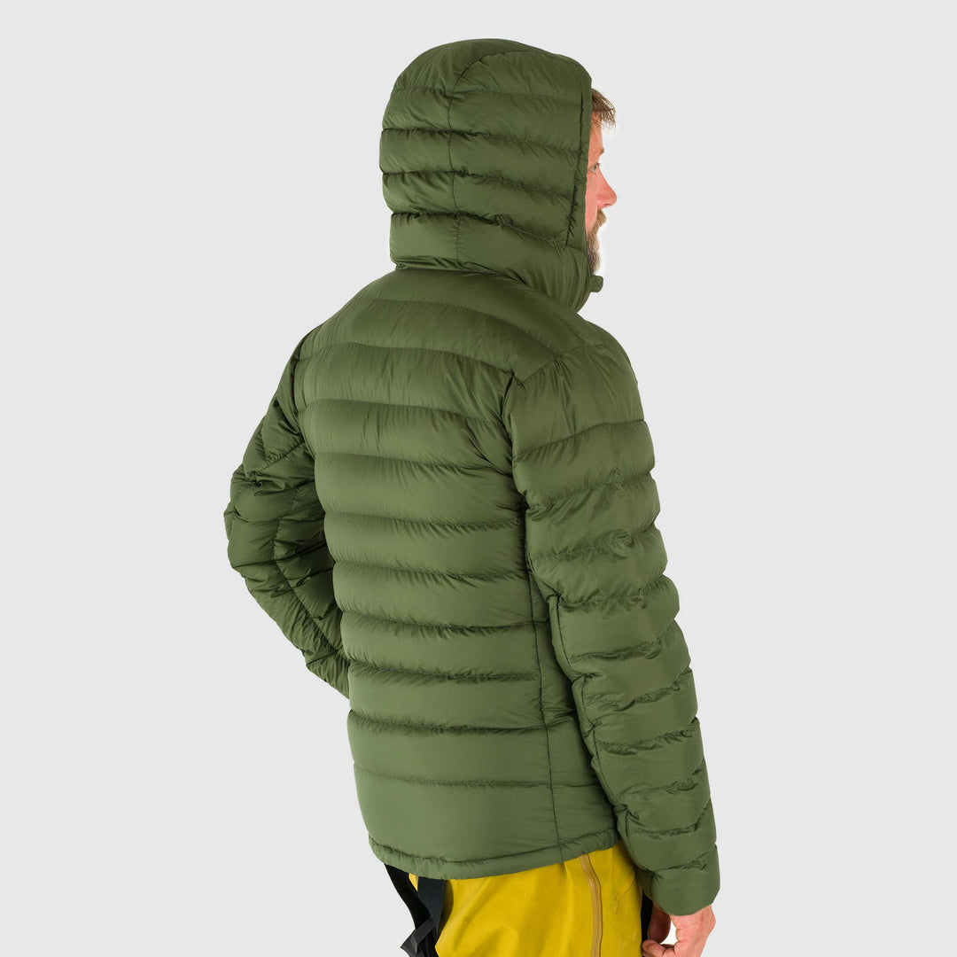 Studio back view of man wearing a chive green Men's Feathered Friends Eos Down Jacket
