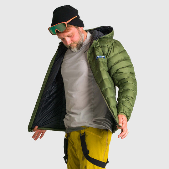 Studio front view of man wearing a chive green Men's Feathered Friends Eos Down Jacket
