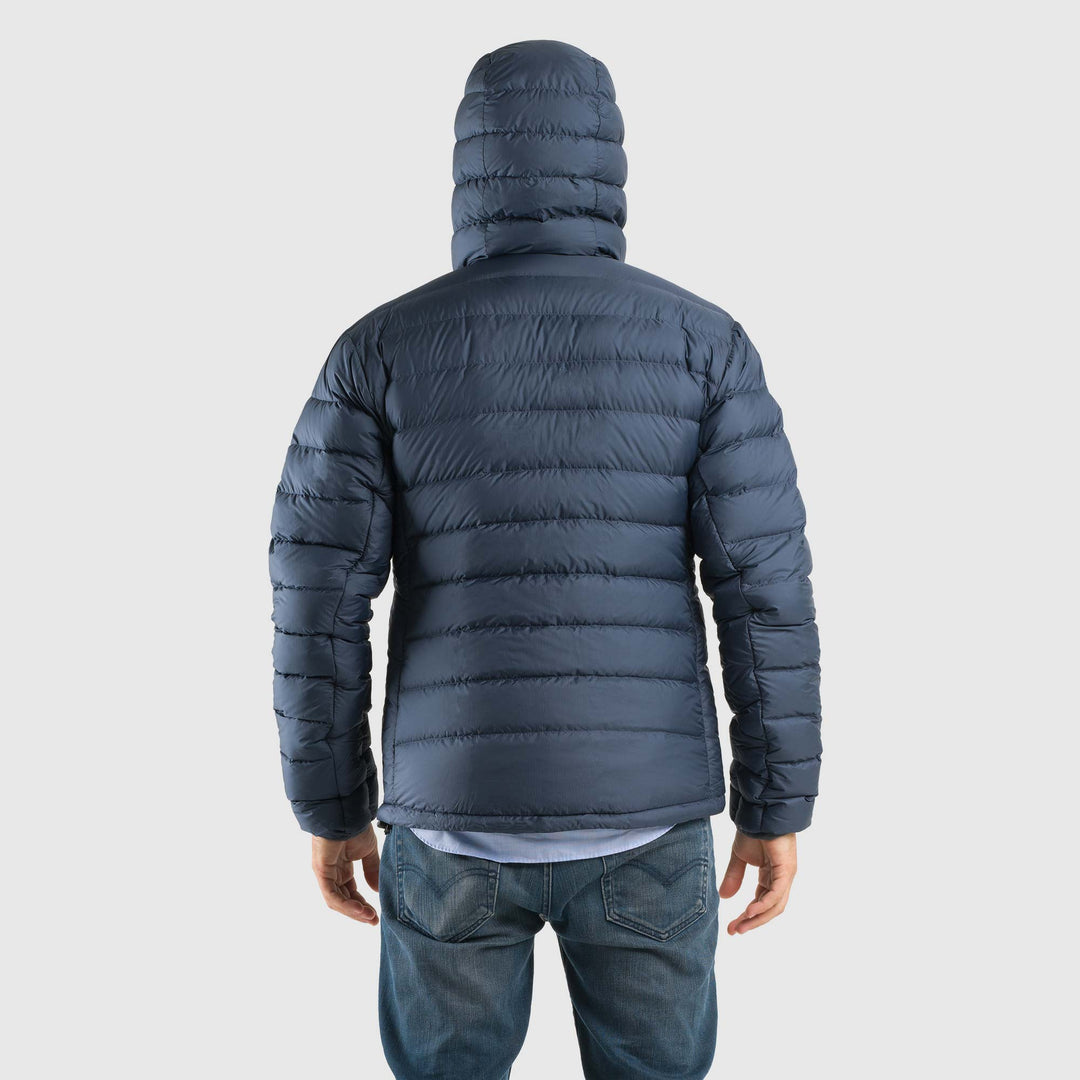 Studio back view of man wearing a midnight blue Men's Feathered Friends Eos Down Jacket