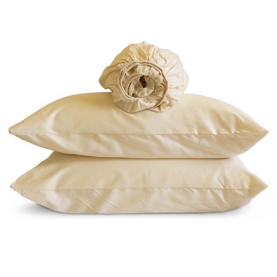 Studio photo of Natural-color Feathered Friends Organic Cotton rolled Fitted Sheet and two pillow cases