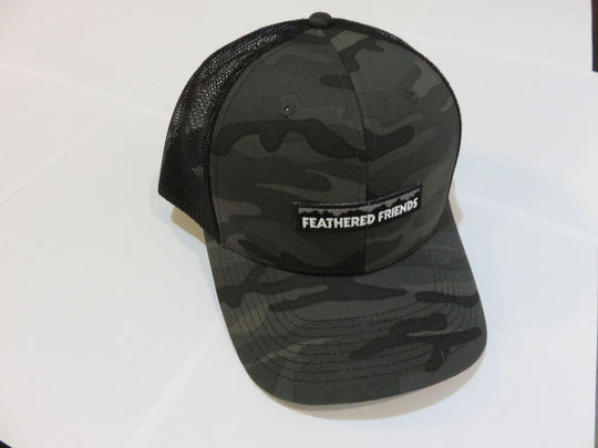 Studio image Feathered Friends Pro Style Mountain Logo Trucker Hat camo black and black colors
