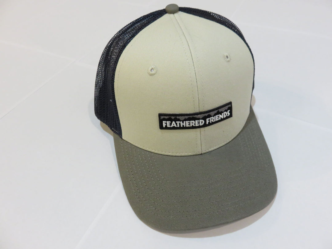 Studio image Feathered Friends Pro Style Mountain Logo Trucker Hat natural, olive, and navy colors