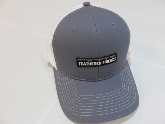 Studio image Feathered Friends Pro Style Mountain Logo Trucker Hat steel blue and white colors