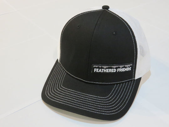 Studio image Feathered Friends Pro Style Offset Logo Trucker Hat black and white colors