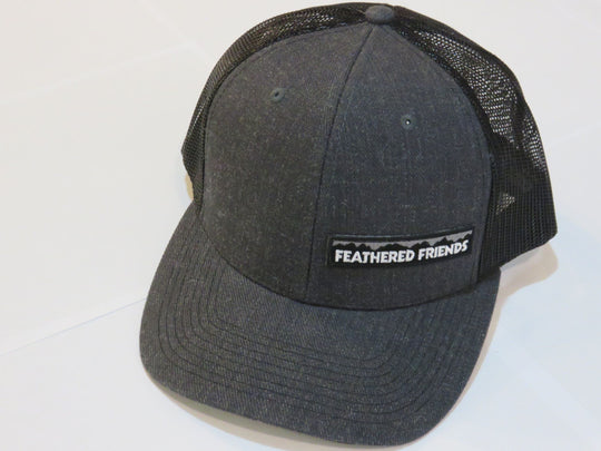 Studio image Feathered Friends Pro Style Offset Logo Trucker Hat heather grey and charcoal black colors