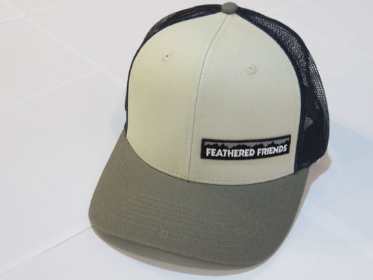 Studio image Feathered Friends Pro Style Offset Logo Trucker Hat natural olive and navy colors