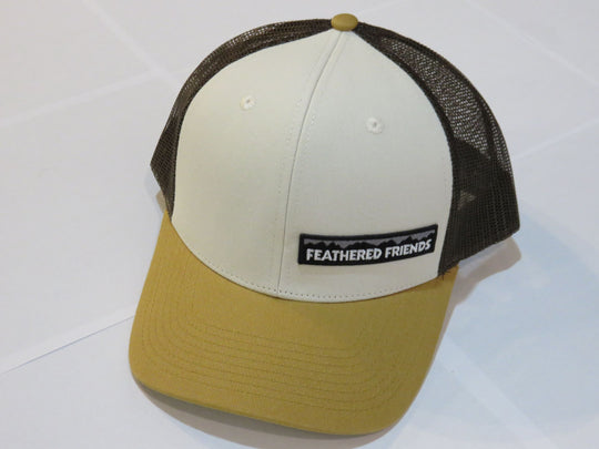 Studio image Feathered Friends Pro Style Offset Logo Trucker Hat stone and amber brown colors