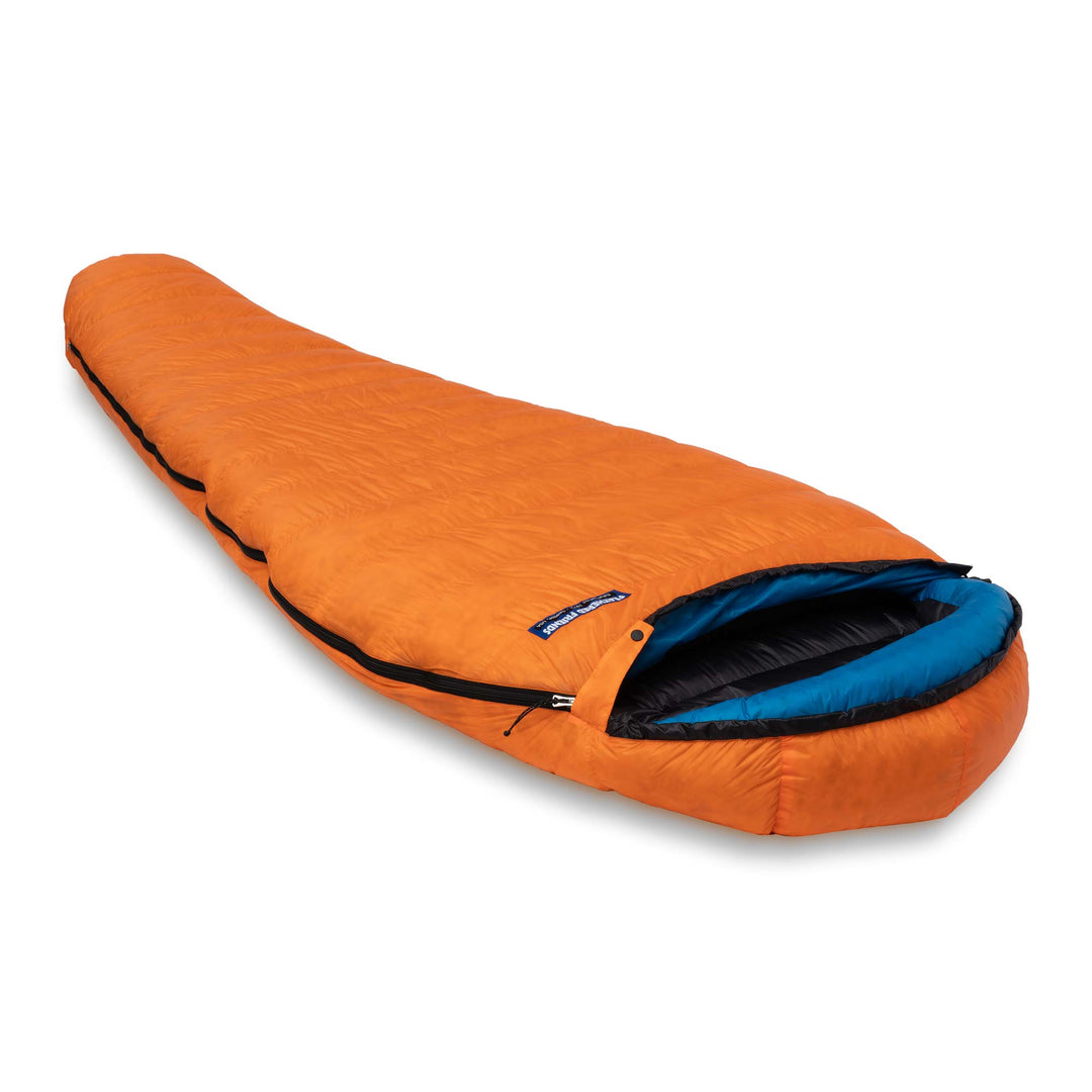 Side angle view of the Feathered Friends Swallow UL ultralight standard width mummy down sleeping bag Flame orange on white background