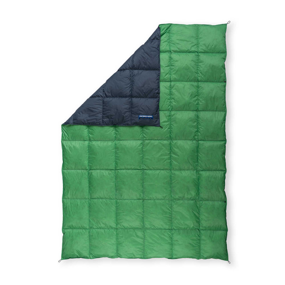 Feathered Friends navy blue and clover green ultralight down blanket on white background