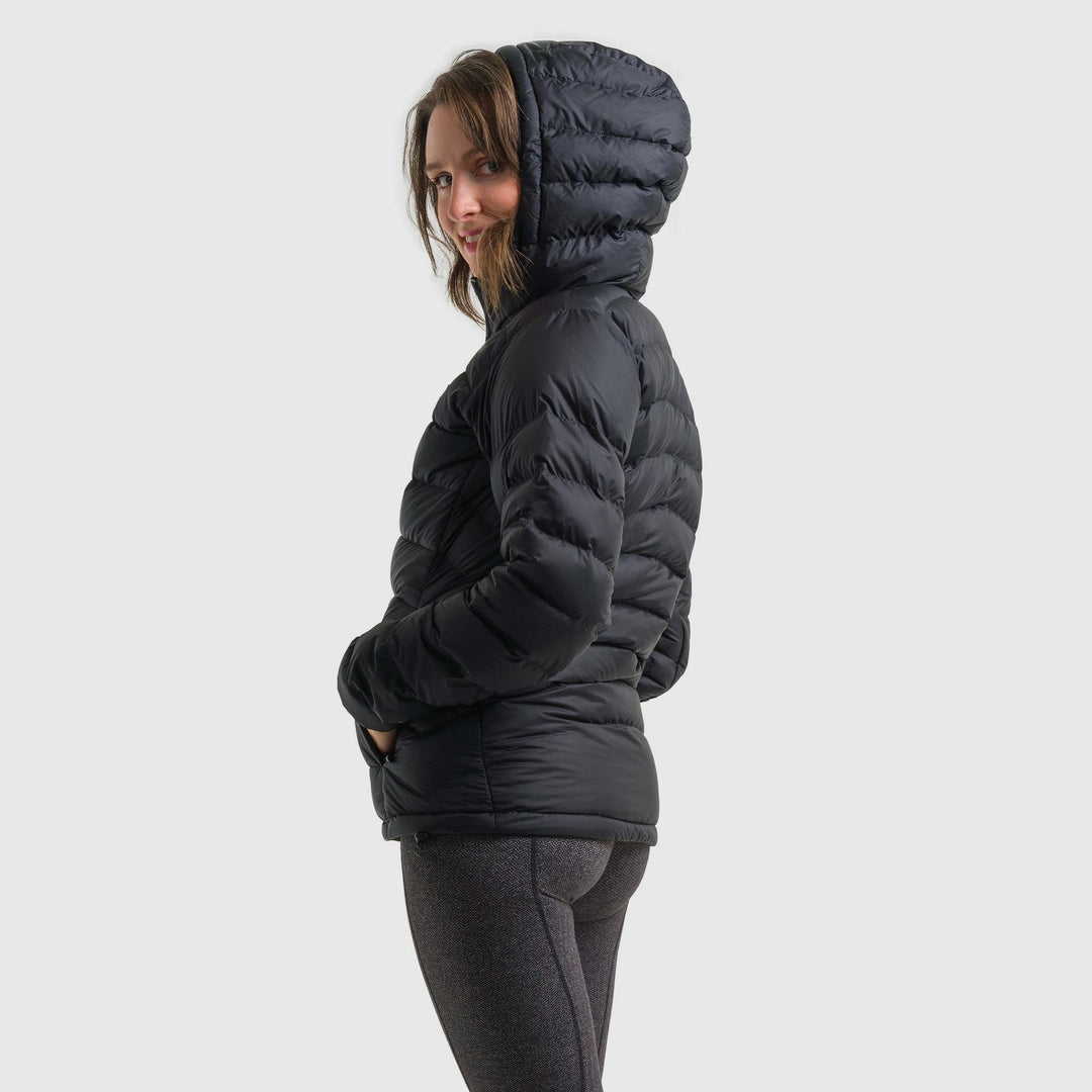 Studio back view of woman wearing a black Women's Feathered Friends Eos Down Jacket