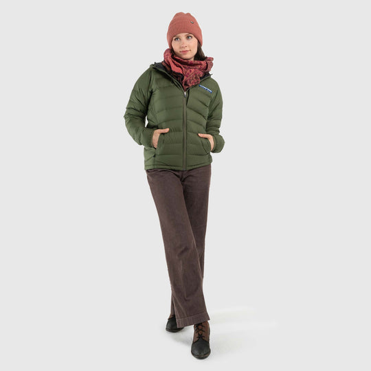 Studio front view of woman wearing a chive green Women's Feathered Friends Eos Down Jacket