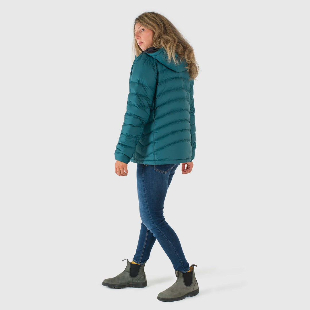 Studio back view of woman wearing a deep teal Women's Feathered Friends Eos Down Jacket