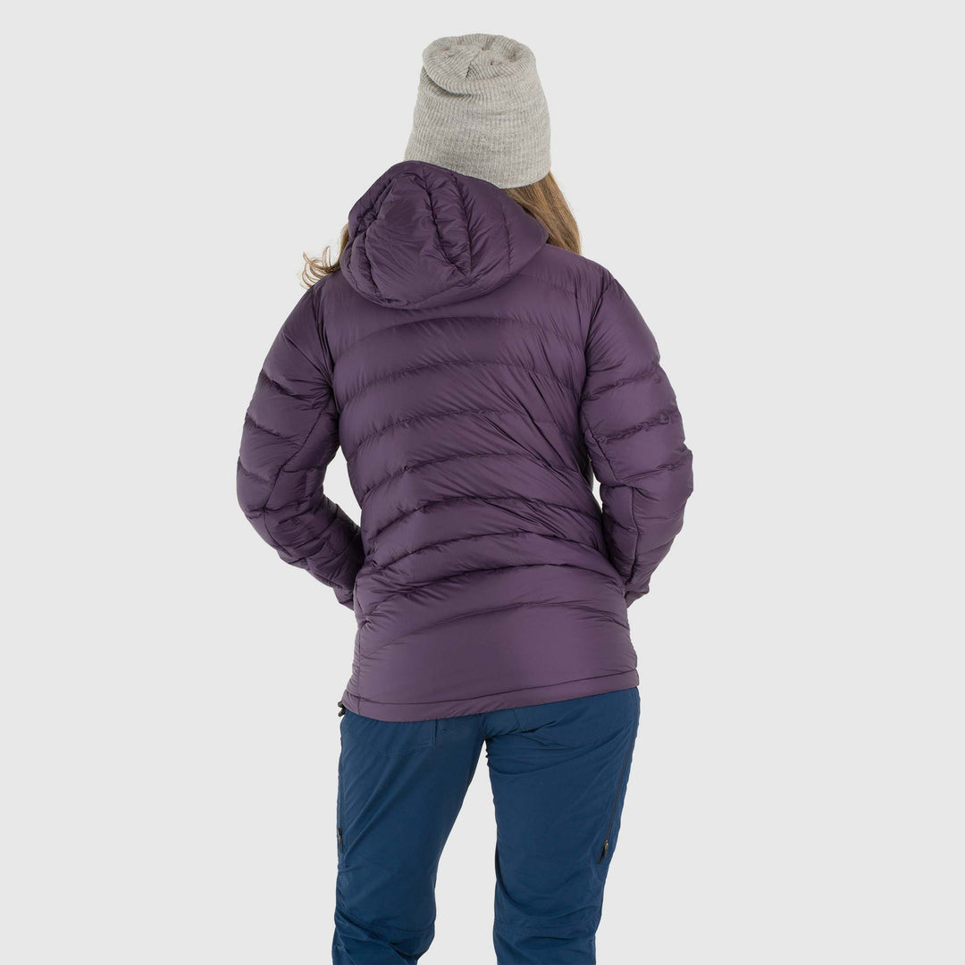 Studio back view of woman wearing a dusky purple Women's Feathered Friends Eos Down Jacket
