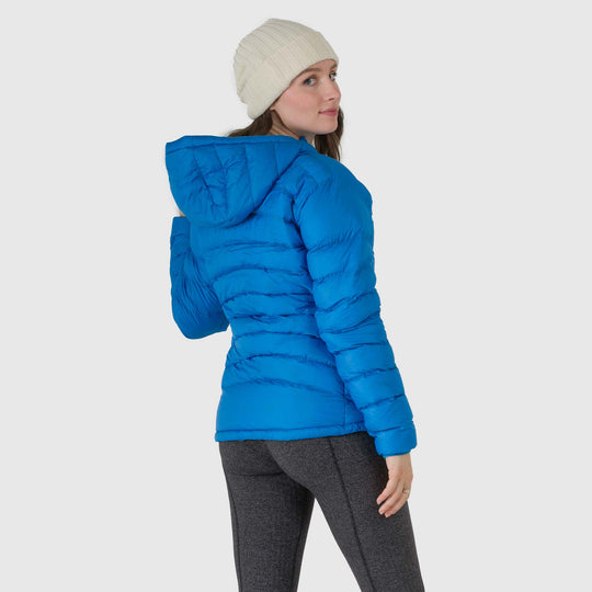 Studio back view of woman wearing a sky blue Women's Feathered Friends Eos Down Jacket