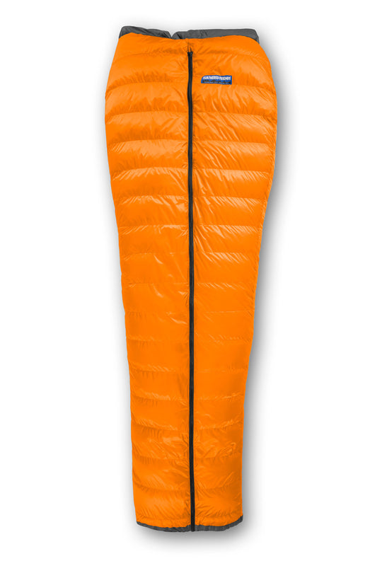 Studio top view of the Feathered Friends Flicker Ultralight Quilt Sleeping Bag in Tangerine Orange color