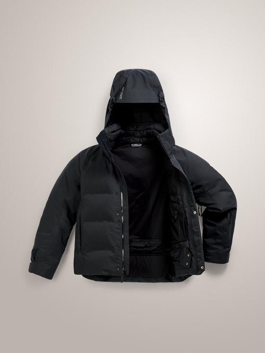 Black Arc'teryx Andessa down jacket with a hood on a light gray background