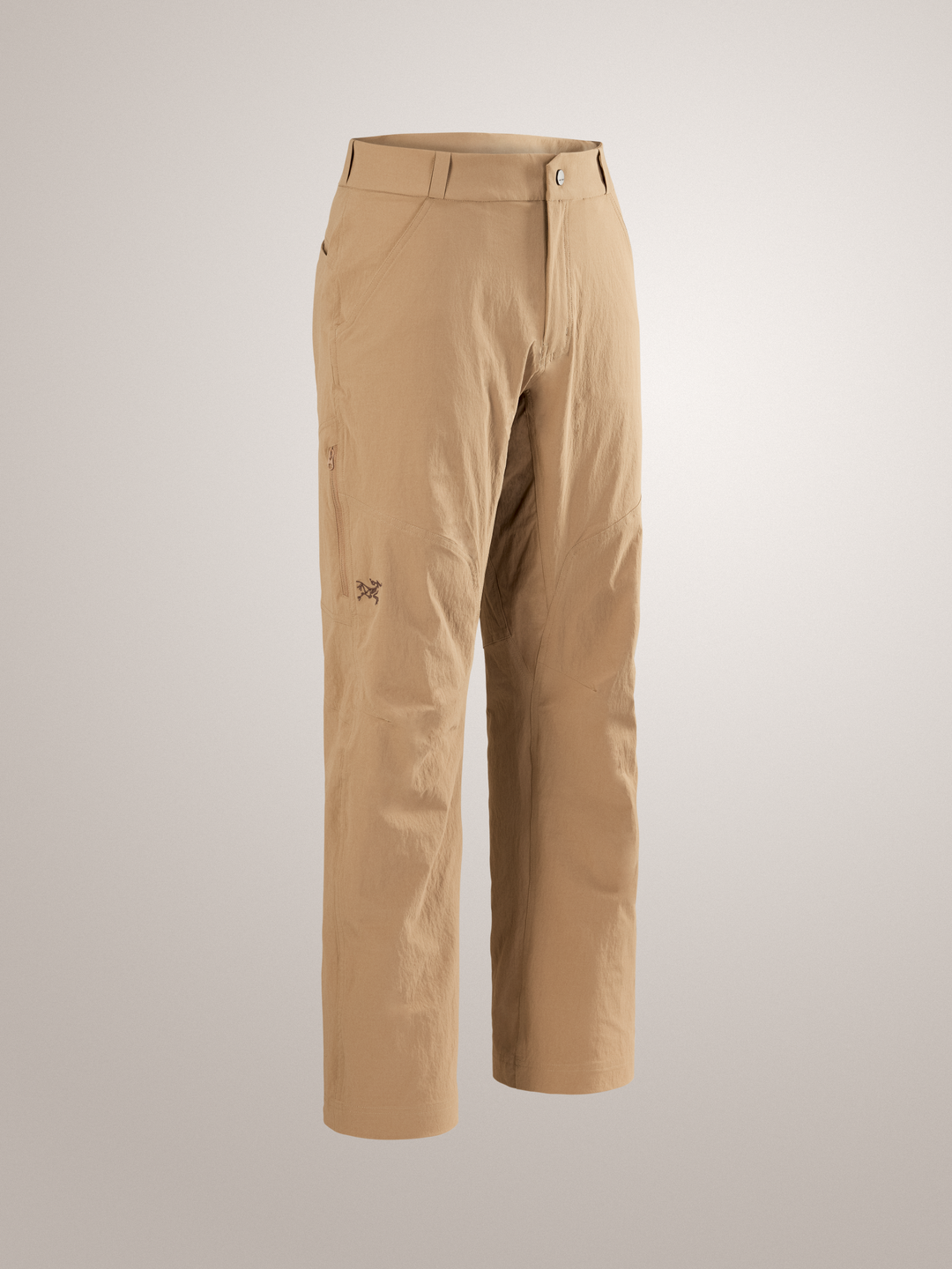 Canvas tan Arc'teryx Cronin Pants on a gray background