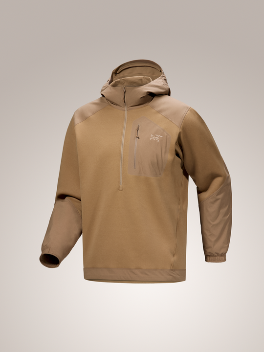 Canvas tan Arc'teryx Konseal hooded pullover jacket on a light gray background