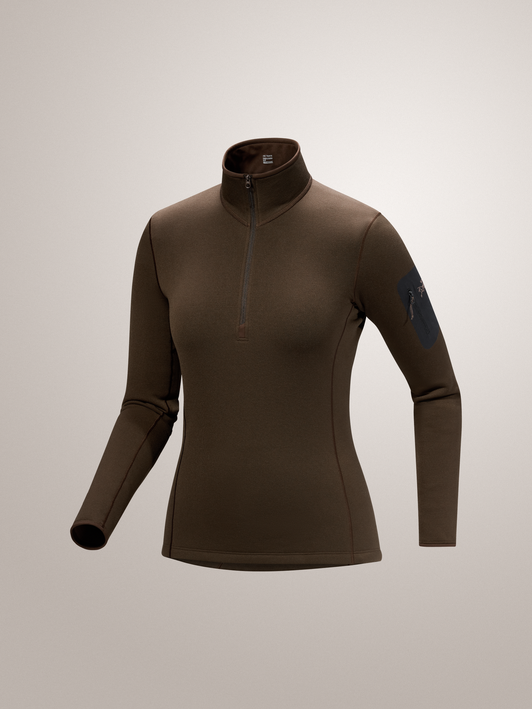 Carob brown Arc'teryx Kyanite baselayer long-sleeve shirt with a quarter zip on a light gray background