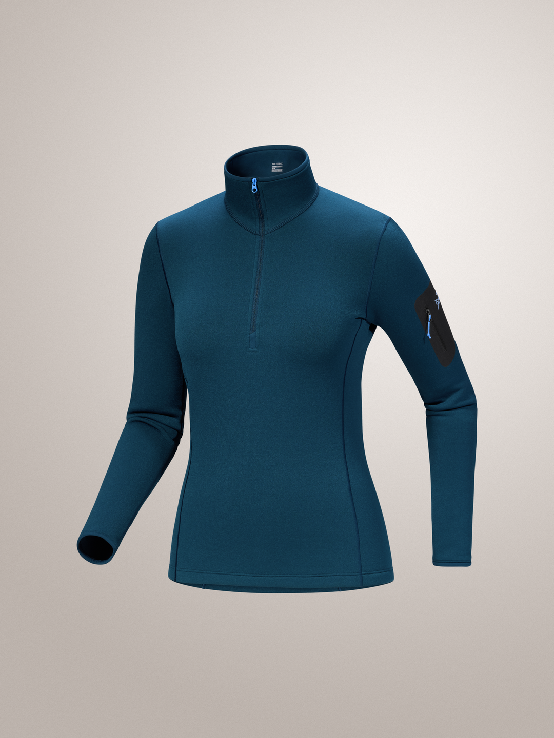 Midnight Frost blue Arc'teryx long-sleeve athletic top on a light gray background
