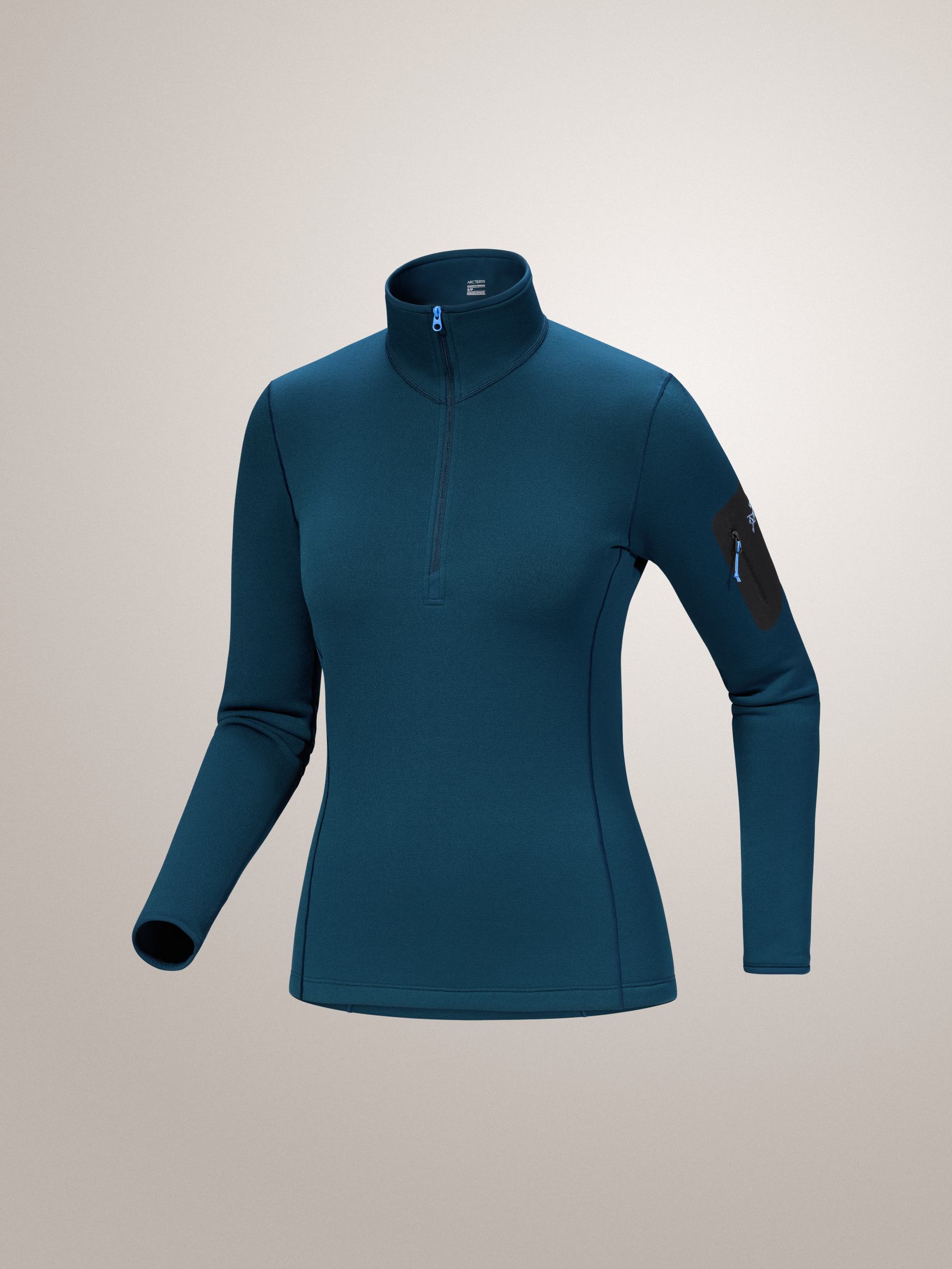 Midnight Frost blue Arc'teryx long-sleeve athletic top on a light gray background