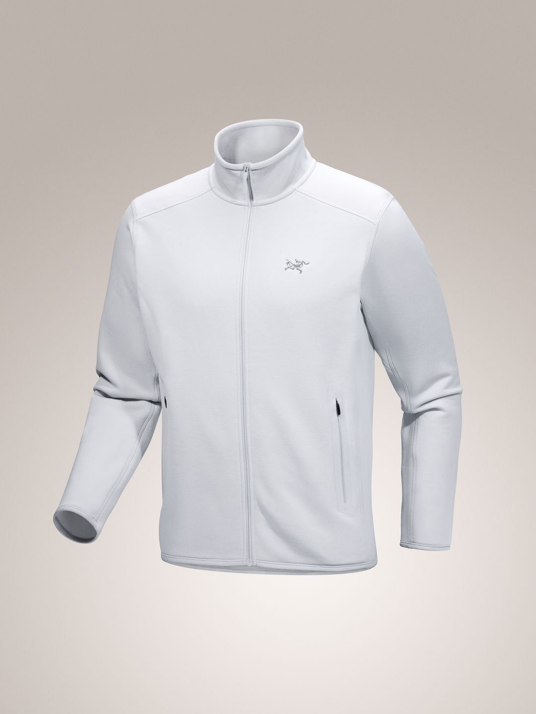 Light gray Arc'teryx Kyanite fleece jacket on a beige background