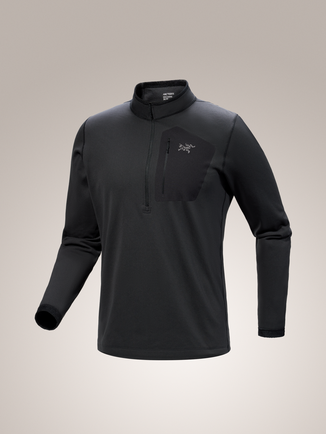 Black Arc'teryx Rho SV half zip long-sleeve shirt with a brand logo on a gray background