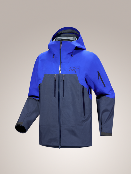 Vitality blue and black Arc'teryx Rush men's jacket on gray background