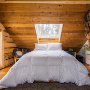 The Feathered Friends Baffled Box 850 Organic Down Comorter in a stunning Tree House bedroom