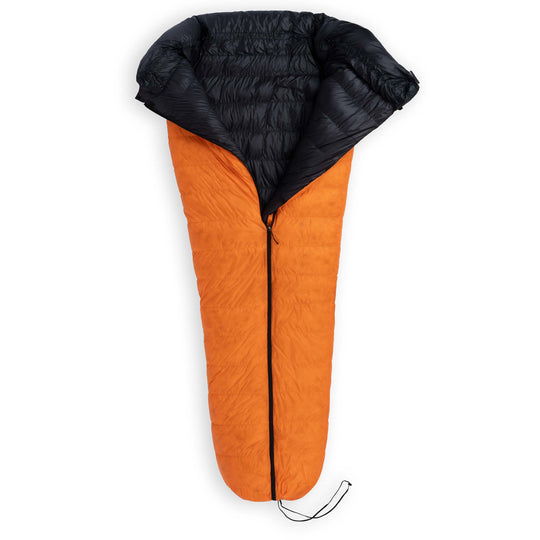 Partially unzipped Feathered Friends Flicker UL Ultralight Down Quilt Sleeping Bag in Flame orange on a white background