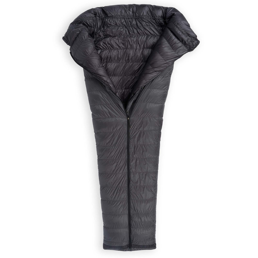 Partially unzipped Feathered Friends Flicker UL Ultralight Down Quilt Sleeping Bag in dark Graphite gray on a white background