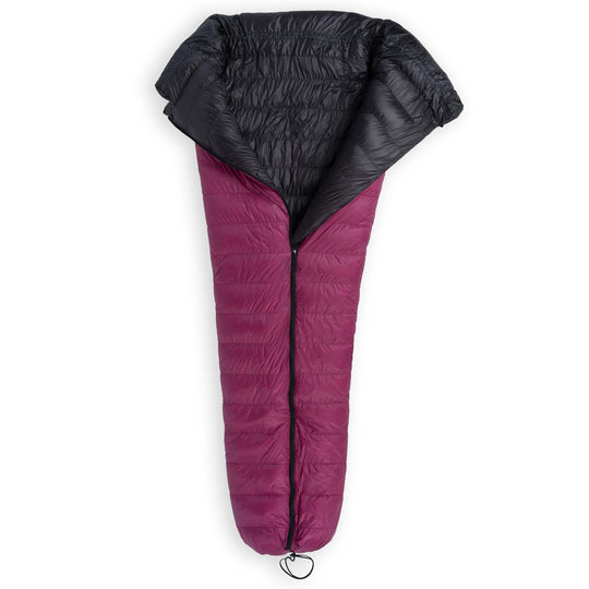 Partially unzipped Feathered Friends Flicker UL Ultralight Down Quilt Sleeping Bag in Magenta purple with a cinched footbox on a white background