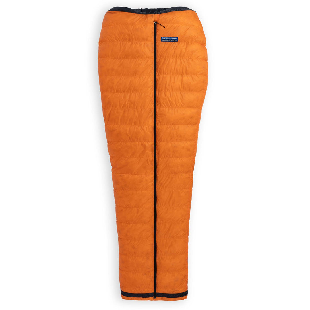 Fully zipped Feathered Friends Flicker UL Wide ultralight down quilt sleeping bag in Flame Orange