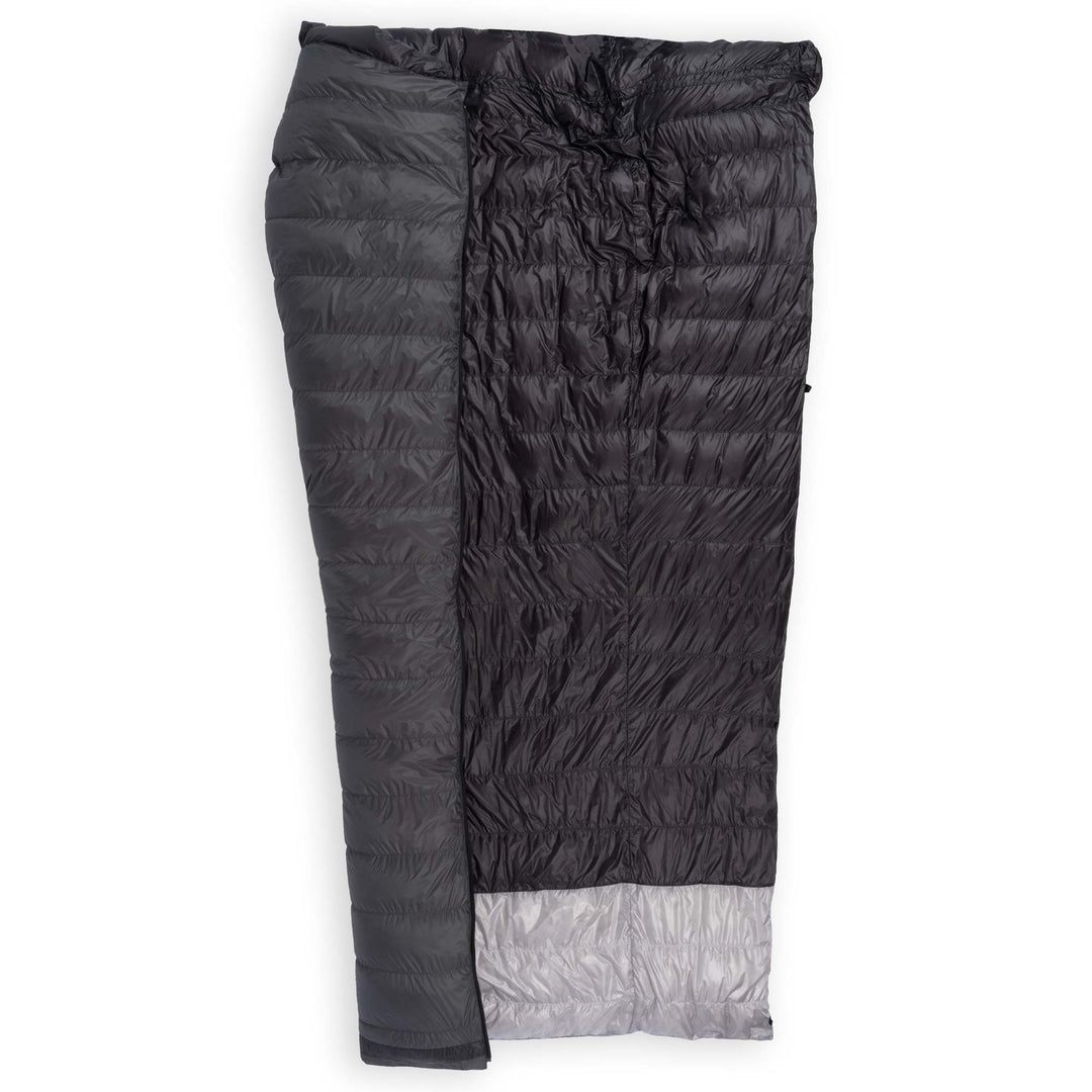 Feathered Friends Flicker UL Wide Ultralight Down Quilt Sleeping Bag in Graphite dark gray half unzipped to display the interior