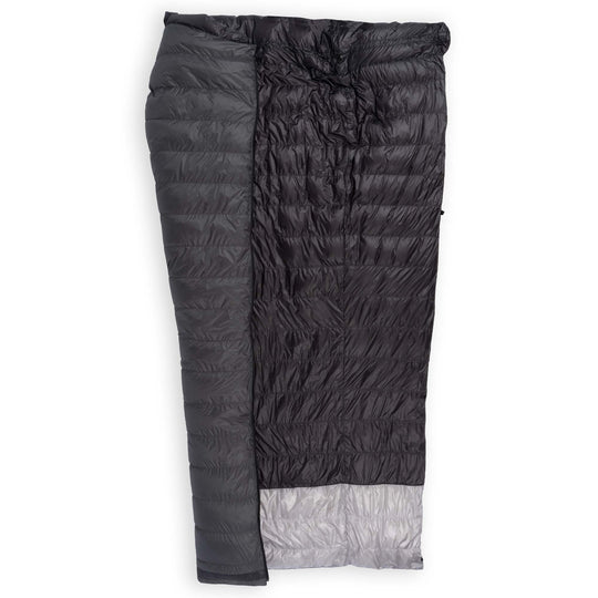 Feathered Friends Flicker UL Wide Ultralight Down Quilt Sleeping Bag in Graphite dark gray half unzipped to display the interior