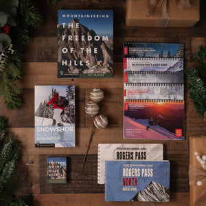 Climbing, backcountry skiing, snowshoe, and hiking guidebooks with holiday decorations