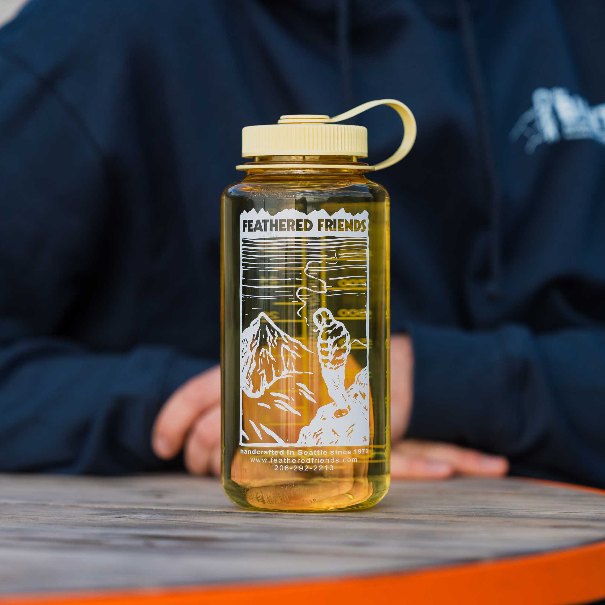 Yellow Feathered Friends Nalgene water bottle with mountain drawing design