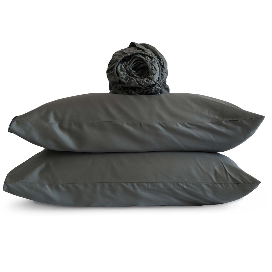 Studio photo of Cascade-color Feathered Friends Organic Cotton rolled Fitted Sheet and two pillow cases