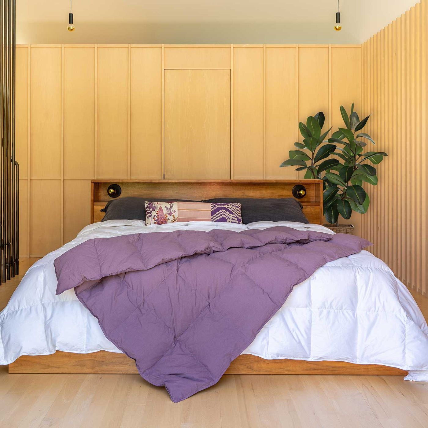 Bedroom with wooden headboard and Dusky Purple Down Throw