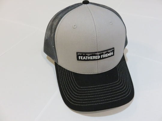 Studio image Feathered Friends Pro Style Mountain Logo Trucker Hat gray, black, and charcoal colors